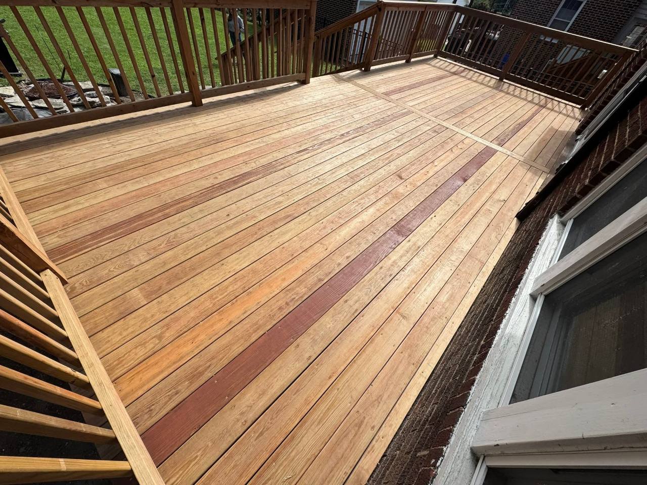 Pressure-treated CedarTone deck surface with contrasting picture-frame detail