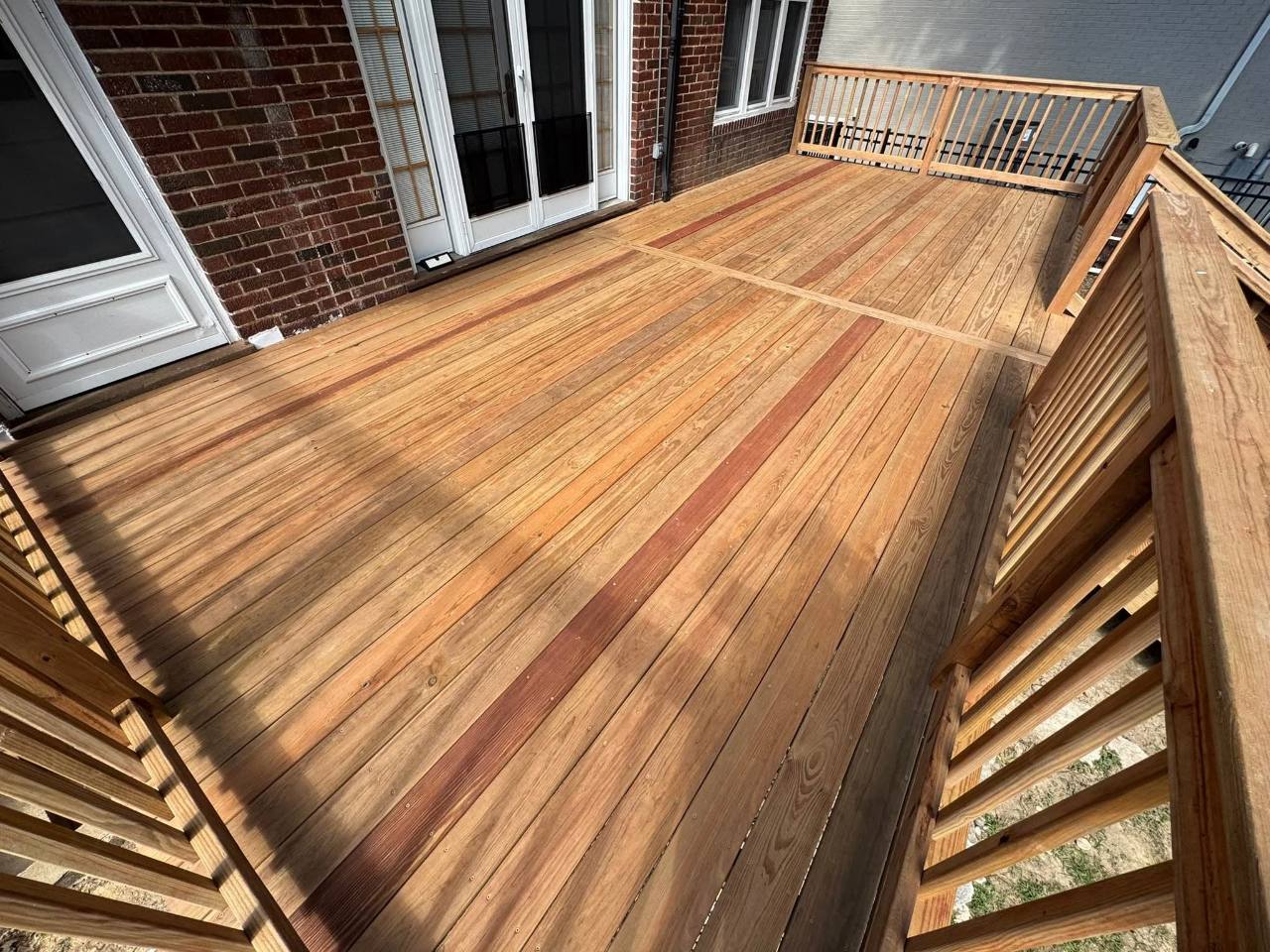 CedarTone deck surface and matching wood railing